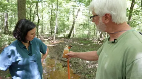'I can't drink the water' Gordon Rogers showing a water sample to the BBC's Michelle Fleury
