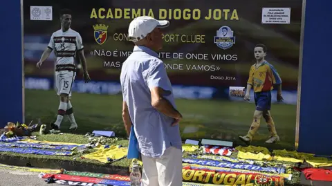 Crowds mourn Liverpool star Jota in his Portuguese hometown Getty Images A man stands in front of a memorial for Liverpool's Portuguese forward Diogo Jota, set up at the Gondomar Sport Clube's stadium