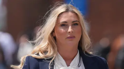 MMA fighter loses appeal in civil rape case PA Media Ms Hand has long blonde hair. She has a plain expression on her face. She is wearing a white blouse and navy jacket.