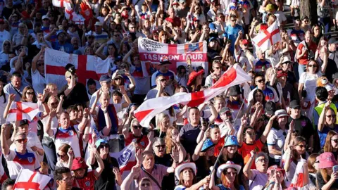 How England fans are preparing for the Euro 2025 final Getty Images England fans taking part in a fan walk to the stadium prior to the UEFA Women's EURO 2025 Semi-Final match between England and Italy. The tightly packed crowds of people are mostly wearing England football shirts and some are wearing England hats and waving large England flags.