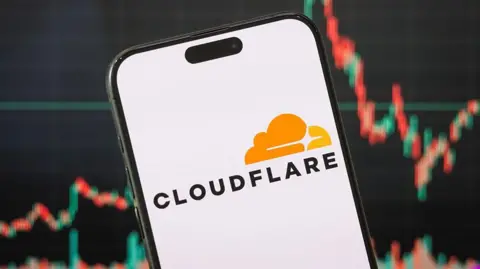 Millions of websites to get 'game-changing' AI bot blocker Getty Images Cloudflare logo on a phone