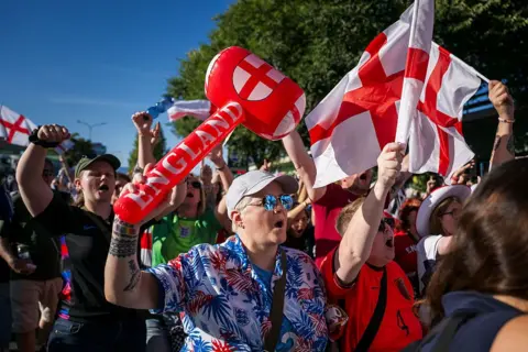 England fans on edge in tight Euro semi-final Getty Images A crowd of England supporters waving red and white flags and inflatable hammers arrive for the UEFA Women's Euro 2025 semi-final football match between England and Italy at the Stade de Geneve in Geneva, on July 22, 2025