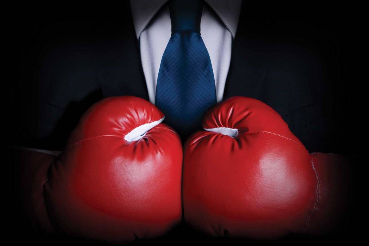 boxing gloves businessman AI job predictions become corporate America's newest competitive sport