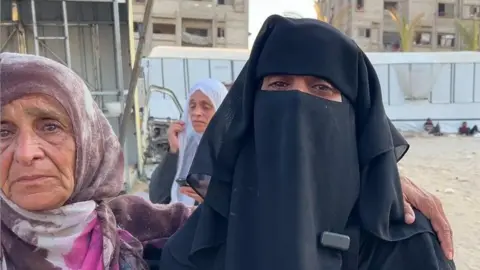 Gaza aid site offered a 'women only' day. It didn't stop the killing Khawla Sheikh al-Eid (R), the sister of Mary Sheikh al-Eid speaks to the BBC outside Nasser Hospital, in Khan Younis, southern Gaza (25 July 2025)