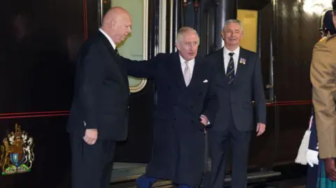 Royal train to be cut in Palace cost-saving measure Getty Images King Charles is seen exiting the royal train in 2023