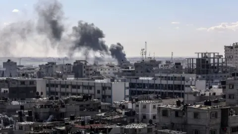 Abed Rahim Khatib/Anadolu via Getty Images Smoke rises over the residential areas following the Israeli attack in Rafah, Gaza on 31 January 2024