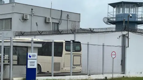 Bella Culley tells court she was tortured into smuggling drugs Rayhan Demytrie A prison entrance in Georgia with a watchtower, high wire fences and barbed wire on the tops of walls.