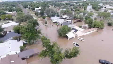 Did officials do enough to warn people? Reuters A drone view shows flooded houses, following torrential rains that unleashed flash floods