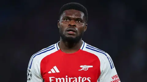 Footballer Thomas Partey charged with rape Getty Images Thomas Partey in Arsenal kit