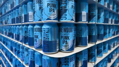 Brewdog to close 10 pubs across UK, some 'within days' Getty Images Bright blue cans of Brewdog's Punk IPA stacked to the ceiling