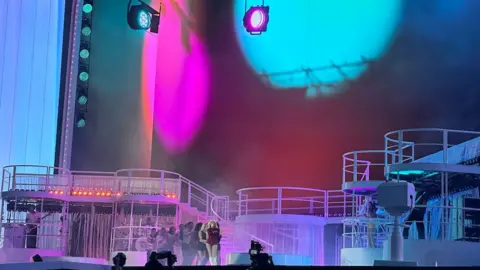 Sabrina Carpenter tones down show Picture of stage with Sabrina Carpenter on it