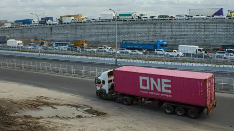 Trucking's uneasy relationship with new tech Getty Images A big red truck on the Nairobi Expressway along the Mombasa road