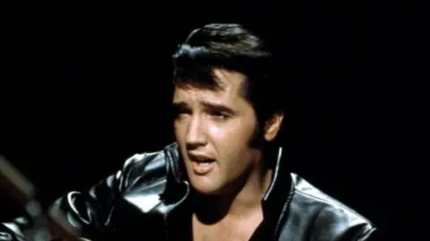 'Atrocious and misleading' show upsets some fans Getty Images Elvis Presley performing on the Elvis comeback TV special on 27 June, 1968. He is wearing a black leather jacket.