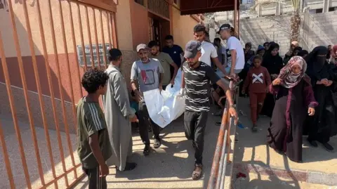 Gaza aid site offered a 'women only' day. It didn't stop the killing Men carry the body of Mary Sheikh al-Eid at Nasser Hospital, in Khan Younis, southern Gaza (25 July 2025)