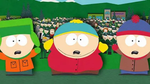 Satirical cartoon moves to Paramount+ after bidding war Comedy Central/Facebook South Park cartoon characters Kyle, Eric and Stan (standing from left to right) standing in front of a crowd of people. The trio have shocked expressions on their faces and their arms are raised.