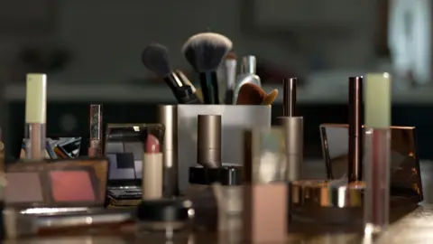 Latin makeup labels put allergy sufferers at risk, say campaigners Makeup products, including mascara, eyeshadow, lipgloss and brushes, spread out on a table