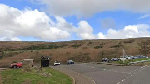 Boy, 15, dies in river incident in Glasgow on hottest day Google A care park under a blue and cloudy sky