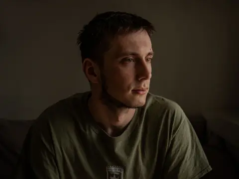 They escaped Ukraine's frontlines. The sound of drones followed them BBC Pavlo, dark-haired and dressed in a green T-shirt, looks away from the camera