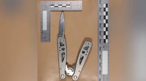 Ammanford stabbing report finds girl was fascinated by weapons and war PA Media The multi-tool knife used by the teenager, pictured alongside a ruler along the top and bottom. The blade is protruding out of the silver metal case.