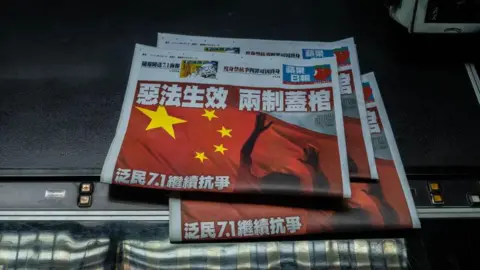 Who is Jimmy Lai, the HK media tycoon on trial for national security crimes? Getty Images "The evil law takes effect and has buried the two systems," read the headlines on copies of Apple Daily in the newspaper's publishing office