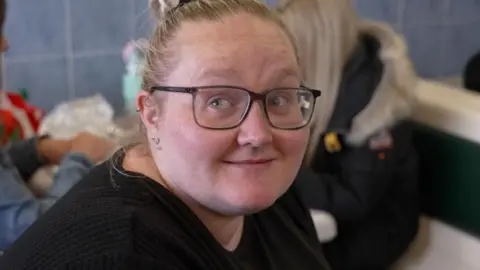 Energy prices expected to rise ahead of winter Elisha sitting in a fish and chip shop