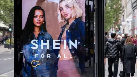 Shein's UK sales rise by a third creating a huge boost to profits Getty Images A bus stop advertising screen displays an add for Shein featuring two women, one wearing a denim jumpsuit and the other wearing pink activewear and a denim jacket.