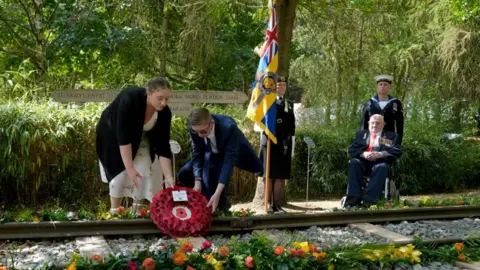 King hails veterans' courage and sacrifice PA Media Second World War veteran Alfred Conway (right) from Lincolnshire, who served with the Royal Navy, watches on as his great-grandchildren, Sarah-Jayne Carpenter (left) and James Carpenter (second left) lay a wreath on the Burma Thailand Railway memorial at the National Memorial Arboretum