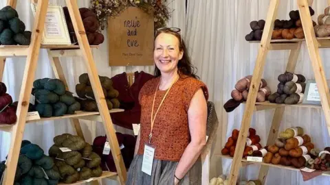UK firms warn over US small parcel tax Helen Hickman Helen stands surrounded by wool from her business