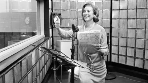 Dame Vera Lynn's audition records to be released 90 years on Getty Images A black and white picture of British singer Vera Lynn rehearsing her new radio show