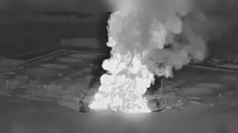 Russia trying to stop meeting on peace and prolong war, says Zelensky Telegram/Madyar Black and white image of an explosion at an oil pumping station