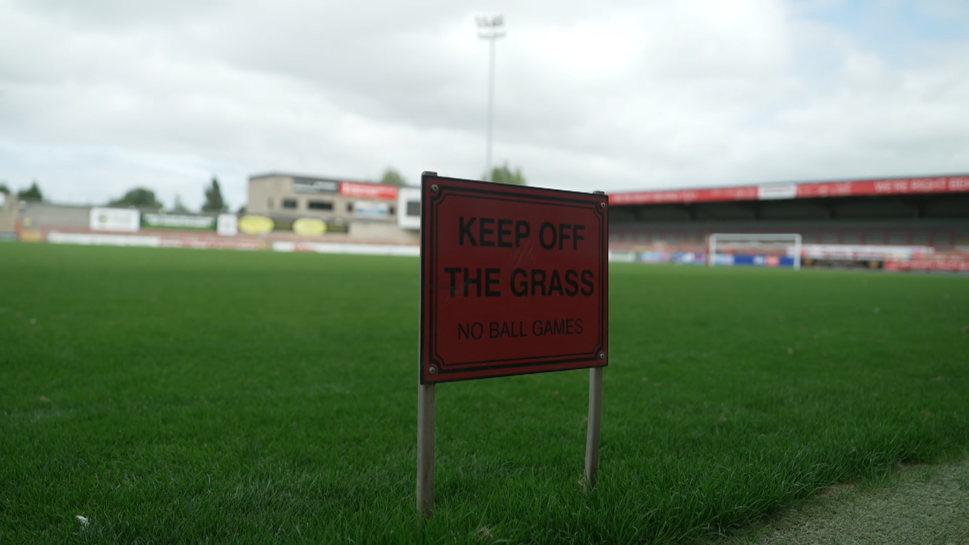 Morecambe takeover: Inside story of Panjab Warriors' first days as owners A sign reads 'keep off the grass' next to the pitch at Morecambe's Mazuma Mobile Stadium