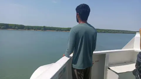 Why India tops the list of abandoned sailors BBC A crew member of Anka cargo vessel, which is abandoned at an Ukrainian port in a river dividing Ukraine and Romania, in blue shirt, watches the expanse of the river from the bow of the vessel.