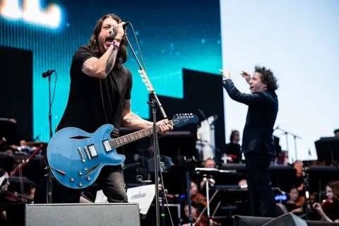 The violinist about to play 10 nights at Wembley with Coldplay Getty Images Dave Grohl sings with the LA Philharmonic on stage at the Coachella Festival this April