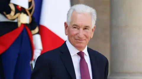 France summons US envoy Charles Kushner over antisemitism claims MOHAMMED BADRA/EPA/Shutterstock United States Ambassador to France Charles Kushner is pictured smiling outside the Elysee palace in Paris. He has white hair and is wearing a dark coloured suit, white shirt with a plum coloured tie.