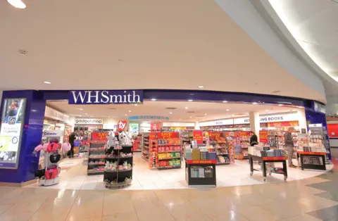 WH Smith shares tumble after accounting blunder Getty Images A WH Smith shop in an airport