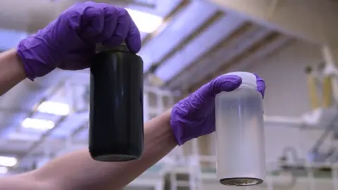 The firms looking to destroy harmful 'forever chemicals' 374Water Two bottles are held up - one containing a brown liquid and one containing a clean liquid