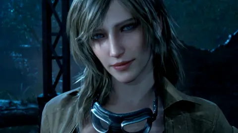 Metal Gear Solid back with remake years after Kojima left Konami Konami A video game character rendered in modern, high-quality graphics. She has long dirty blonde hair and blue eyes. She is wearing a jacket and has goggles hanging around her neck.