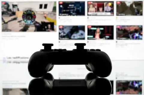 Twitch streamer Alyska and the female gamers defying stereotypes Getty Images A games console controller backlit by a screen showing a Twitch profile