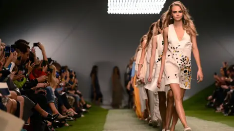 Topshop returns to the high street, but can it get its cool back? Getty Images Cara Delevingne walks the runway of the Unique show during London Fashion Week SS14 at TopShop Show Space on September 15, 2013 in London, England.