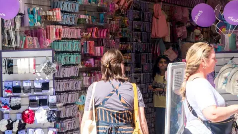 Claire's was glitz 'heaven' for kids before Shein and TikTok came along Matthew Chattle/Future Publishing via Getty Images Shoppers inside a Claire's store with rows of merchandise