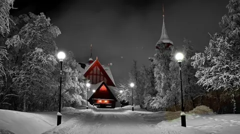 Entire church begins two-day journey across Swedish city of Kiruna Robert Ylitalo Kiruna church at night in the snow