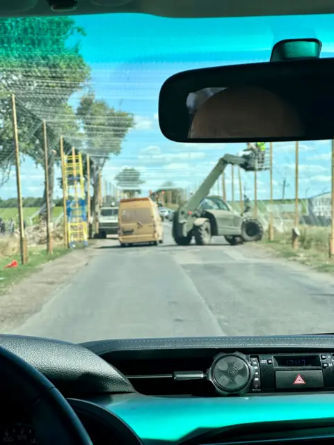 Inside Donetsk as residents flee attacks on Ukrainian region Putin wants to control Green netting above the road to protect it from Russian drones