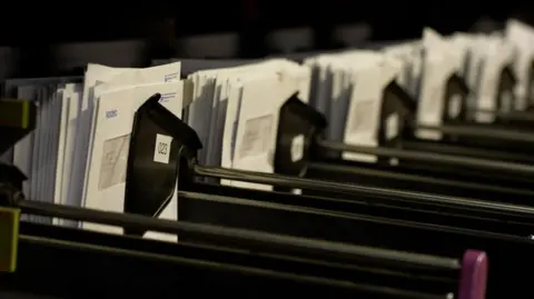 Denmark's state postal service calls time on letter deliveries Letters being grouped at PostNord's sorting office
