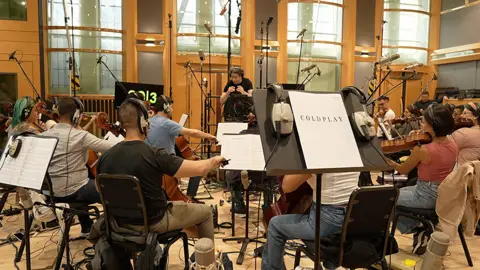 The violinist about to play 10 nights at Wembley with Coldplay Gustavo Dudamel conducts the Simón Bolívar Orchestra at London's Air Studios on 20 August 2025