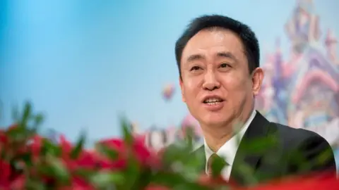 Chinese property giant to be delisted after spectacular fall Getty Images Hui Ka Yan, chairman of China Evergrande Group, speaks during a news conference in Hong Kong, China, on Tuesday, March 26, 2019.