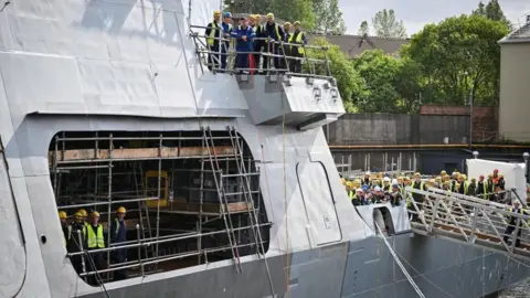UK secures £10bn deal to supply Norway with warships PA Media Members of staff watch Prime Minister Sir Keir Starmer during a visit to BAE Systems in Govan, Glasgow, to launch the Strategic Defence Review.