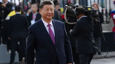 Why should I care about the crisis-hit Chinese property giant? Getty Images Xi Jinping, China's president, arrives for a bilateral meeting in Peru in navy blue suit.