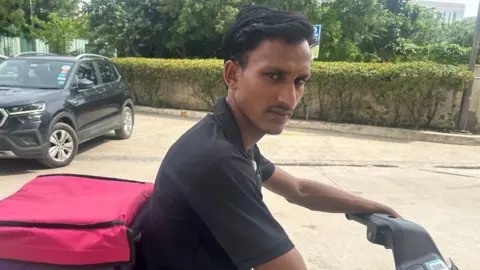 How to get AI to work in its 22 languages Priti Gupta Vineet Sawant sits on his scooter