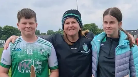 Victims of fatal shooting to be laid to rest in County Clare Handout Vanessa Whyte, centre standing with her arms around her son and daughter, James and Sara.