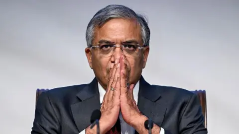 Why India's polling monitor is facing a test of credibility Getty Images Gyanesh Kumar, Chief Election Commissioner (CEC) of India, wearing a grey suit gestures with folded hands, as he addresses a press conference in New Delhi on August 17, 2025.